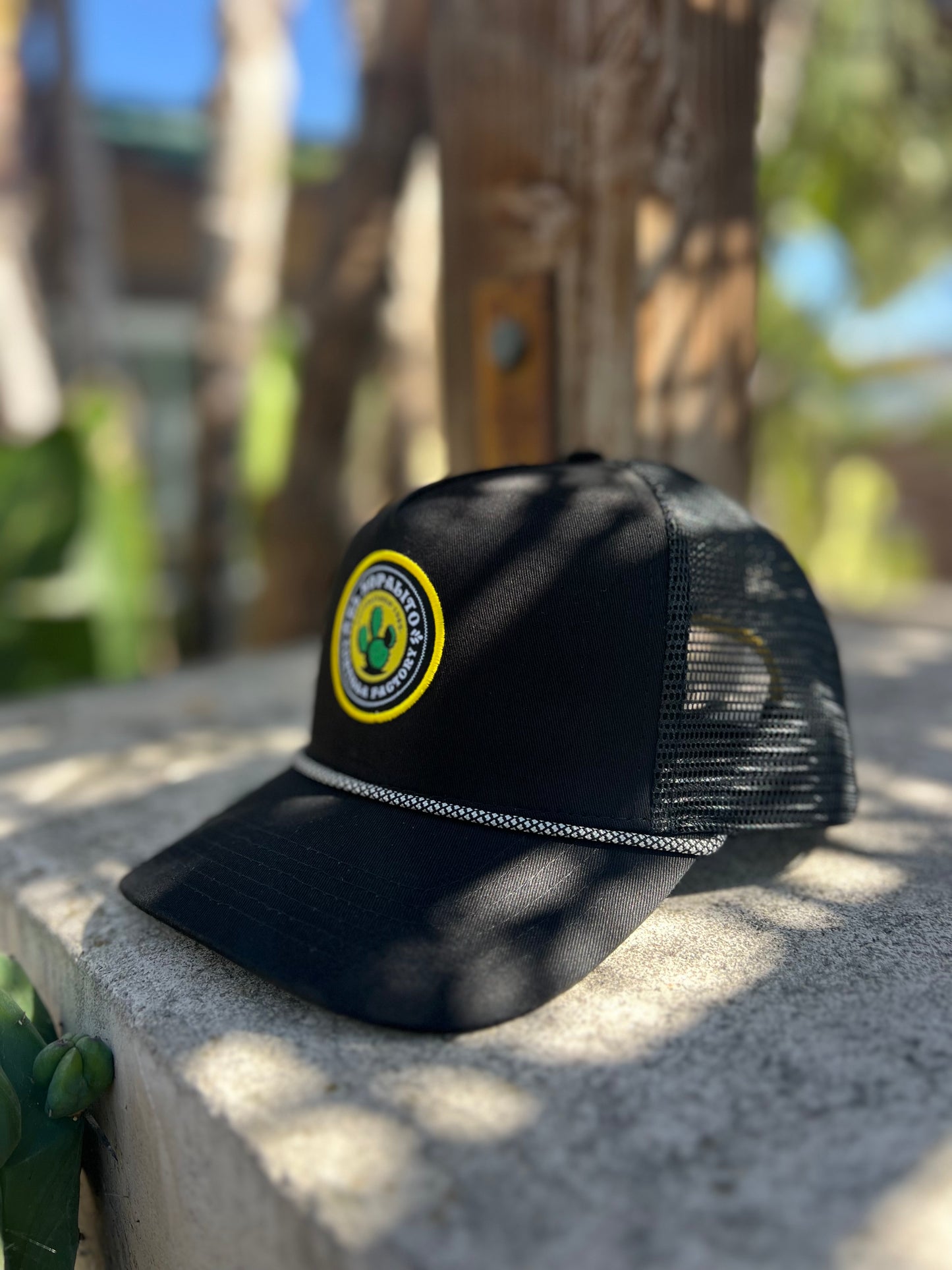 Adult SnapBack hat in black with patch & yellow stitch